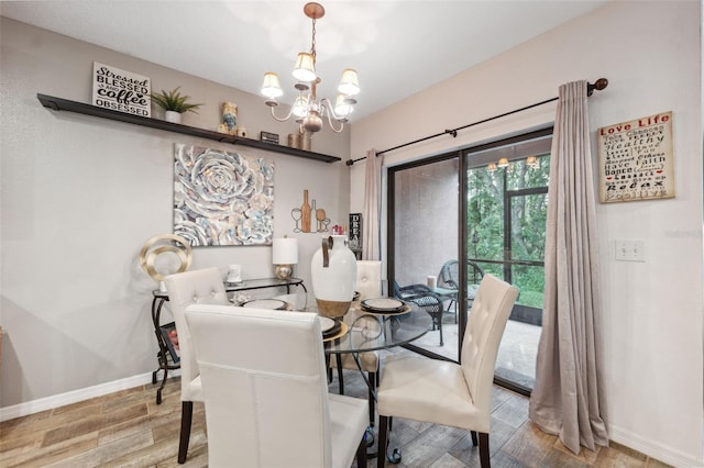 1108 Blackwater Dr, Wesley Chapel, FL 33543 - dining room featuring a chandelier, baseboards, and wood finished floors