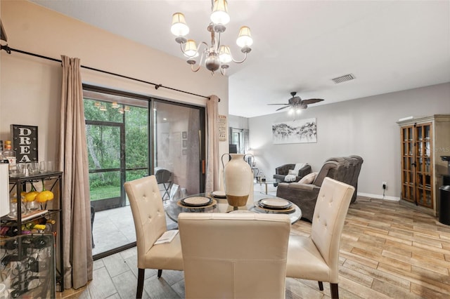 1108 Blackwater Dr, Wesley Chapel, FL 33543 - dining area featuring a chandelier, a ceiling fan, light wood-type flooring, and baseboards