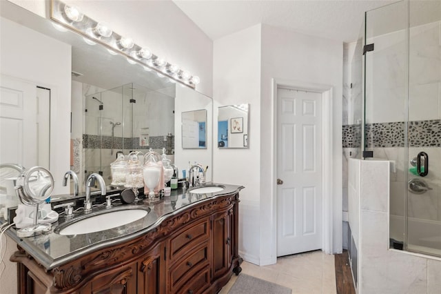 1108 Blackwater Dr, Wesley Chapel, FL 33543 - bathroom featuring a stall shower, double vanity, and tile patterned flooring
