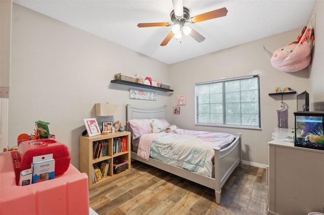 1108 Blackwater Dr, Wesley Chapel, FL 33543 - bedroom featuring wood finished floors, a ceiling fan, and baseboards