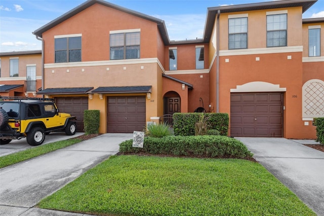 1108 Blackwater Dr, Wesley Chapel, FL 33543 - view of property with a garage, driveway, and stucco siding