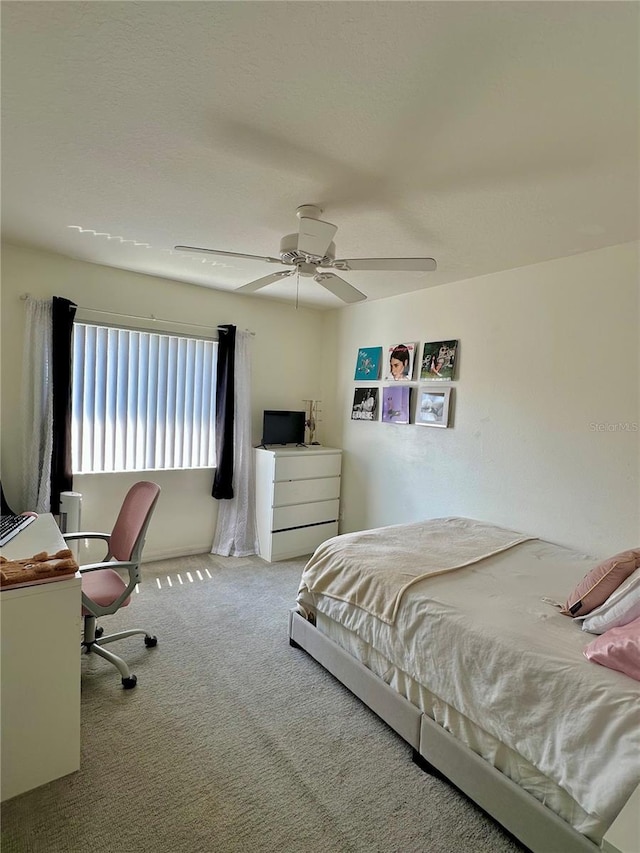 9808 Riverchase Dr, New Port Richey, FL 34655 - carpeted bedroom featuring ceiling fan and a desk