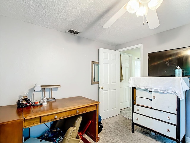 office featuring a textured ceiling and ceiling fan
