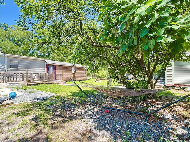 view of yard with a wooden deck