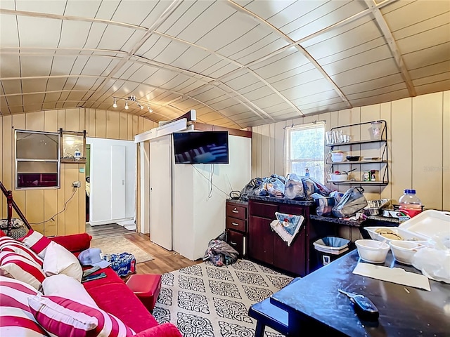 living room with lofted ceiling and wood finished floors
