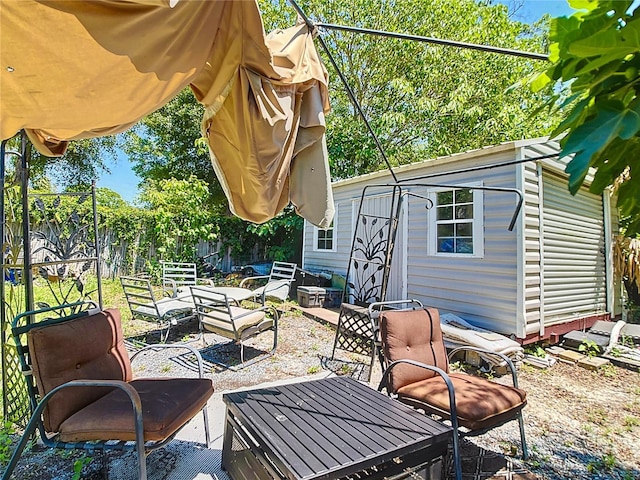 fenced backyard with a patio area