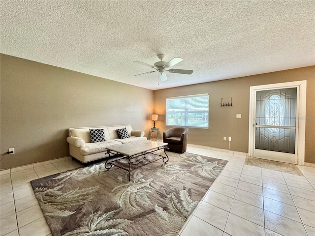 11619 Boynton Ln, New Port Richey, FL 34654 - tiled living area featuring ceiling fan and a textured ceiling