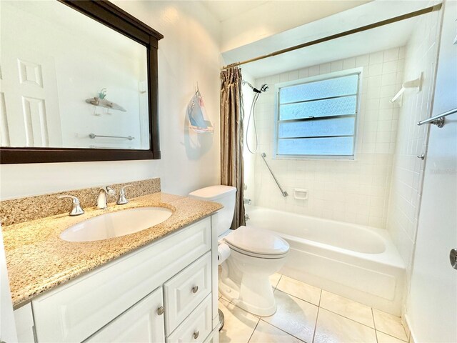 11619 Boynton Ln, New Port Richey, FL 34654 - bathroom with shower / tub combo, vanity, tile patterned floors, and toilet