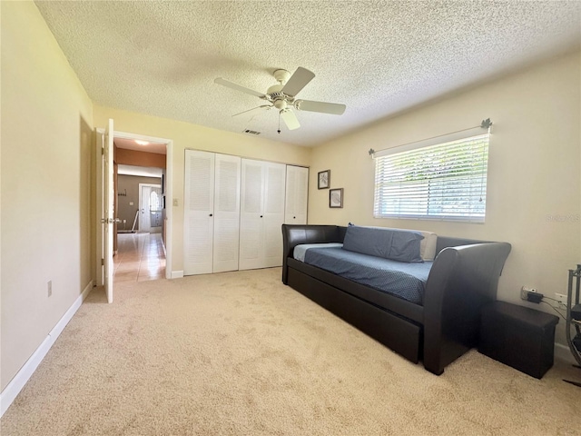 11619 Boynton Ln, New Port Richey, FL 34654 - living area with carpet floors, ceiling fan, a textured ceiling, and baseboards
