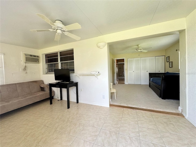 11619 Boynton Ln, New Port Richey, FL 34654 - unfurnished living room featuring ceiling fan, tile patterned floors, a wall mounted air conditioner, and baseboards