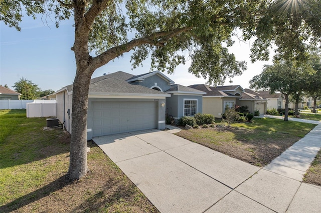 15159 Durango Cir, Brooksville, FL 34604 - ranch-style house featuring stucco siding, an attached garage, central AC, driveway, and roof with shingles