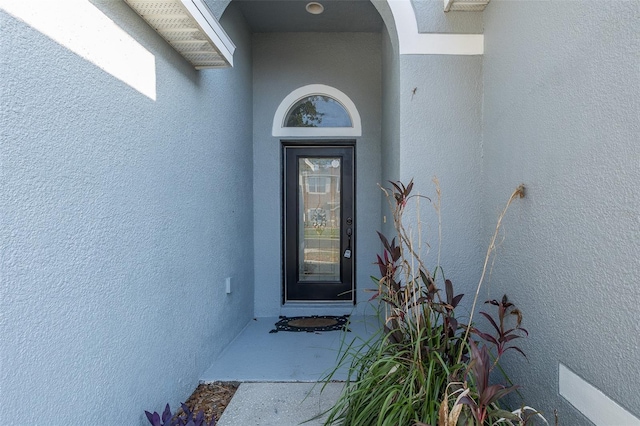 15159 Durango Cir, Brooksville, FL 34604 - doorway to property featuring stucco siding