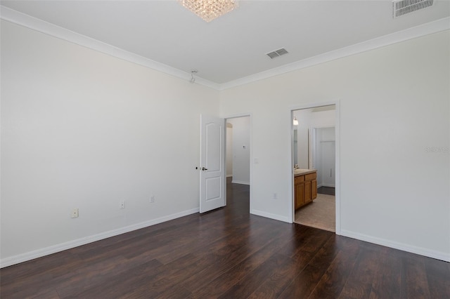 15159 Durango Cir, Brooksville, FL 34604 - spare room featuring crown molding, dark wood-type flooring, and baseboards