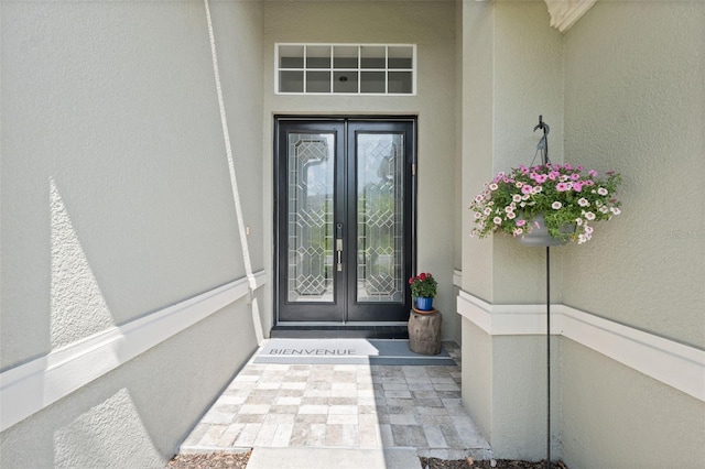 3243 Stonegate Falls Dr, Land O Lakes, FL 34638 - doorway to property featuring french doors and stucco siding