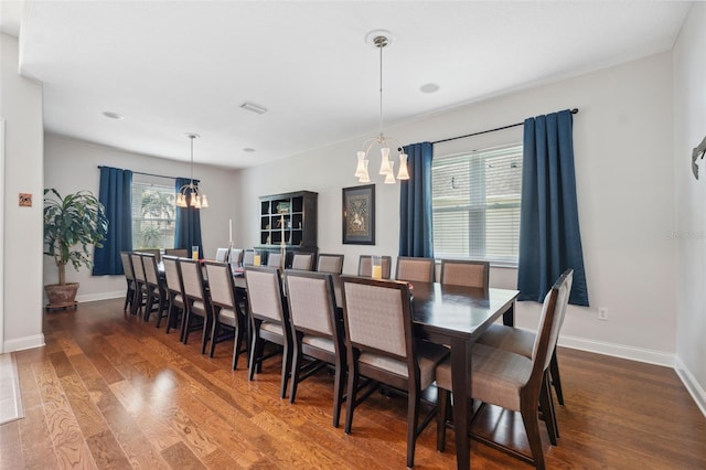 3243 Stonegate Falls Dr, Land O Lakes, FL 34638 - dining area featuring a chandelier, dark wood finished floors, baseboards, and recessed lighting