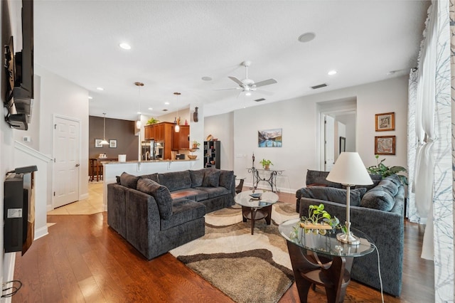 3243 Stonegate Falls Dr, Land O Lakes, FL 34638 - living area with a ceiling fan, wood finished floors, recessed lighting, and baseboards