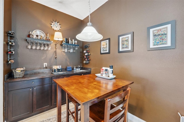 3243 Stonegate Falls Dr, Land O Lakes, FL 34638 - indoor bar featuring lofted ceiling and decorative light fixtures