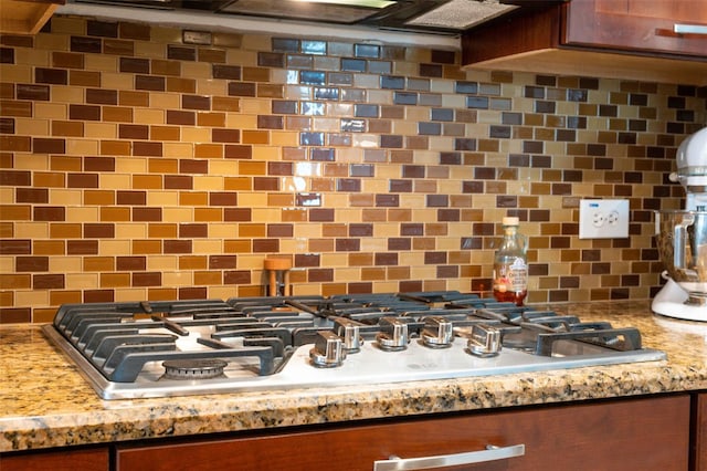 3243 Stonegate Falls Dr, Land O Lakes, FL 34638 - kitchen view of stainless steel gas cooktop and tasteful backsplash