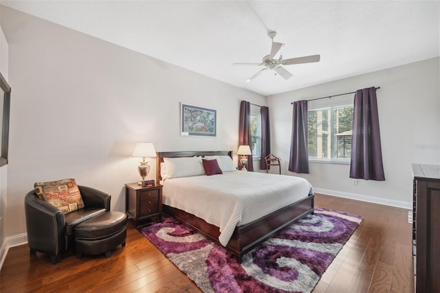 3243 Stonegate Falls Dr, Land O Lakes, FL 34638 - bedroom featuring dark wood-style floors, baseboards, and ceiling fan