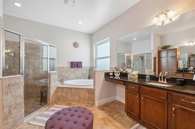3243 Stonegate Falls Dr, Land O Lakes, FL 34638 - bathroom with tile patterned floors, a garden tub, vanity, a stall shower, and recessed lighting
