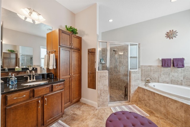 3243 Stonegate Falls Dr, Land O Lakes, FL 34638 - bathroom with a bath, a shower stall, vanity, tile patterned floors, and lofted ceiling