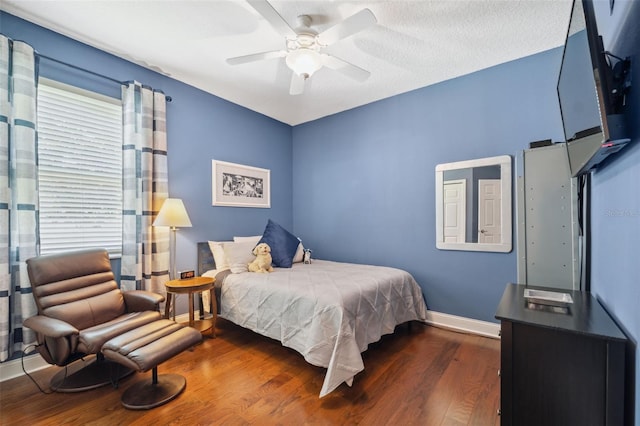 3243 Stonegate Falls Dr, Land O Lakes, FL 34638 - bedroom featuring wood finished floors, baseboards, and a ceiling fan