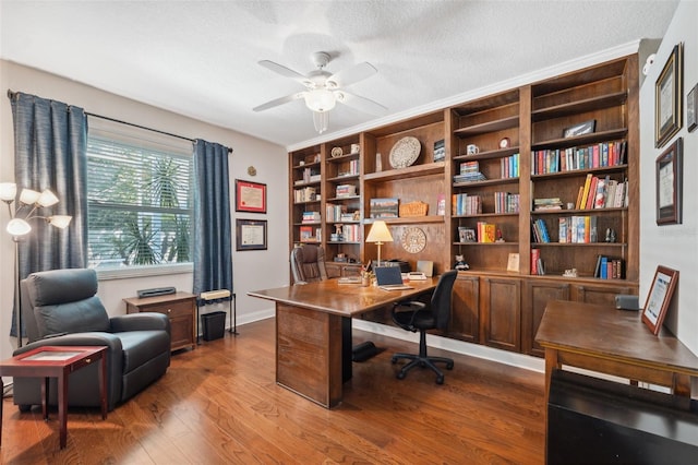 3243 Stonegate Falls Dr, Land O Lakes, FL 34638 - office featuring ceiling fan, dark wood-type flooring, baseboards, and a textured ceiling