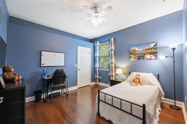 3243 Stonegate Falls Dr, Land O Lakes, FL 34638 - bedroom with wood finished floors, baseboards, and ceiling fan
