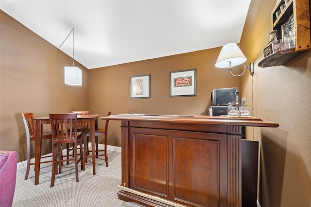 3243 Stonegate Falls Dr, Land O Lakes, FL 34638 - office area featuring light carpet, vaulted ceiling, and baseboards