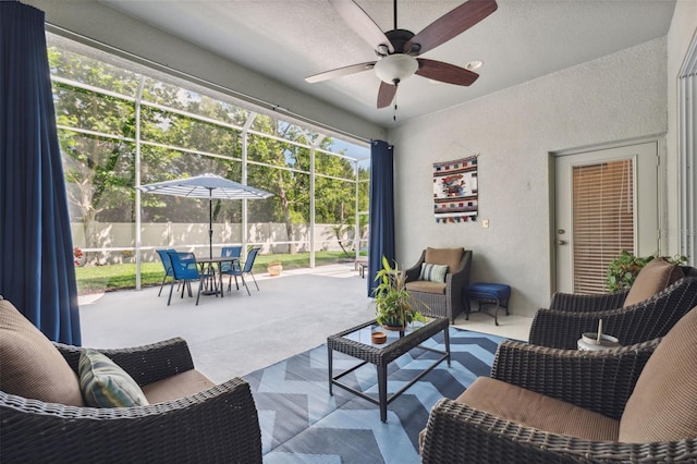 3243 Stonegate Falls Dr, Land O Lakes, FL 34638 - living area featuring a ceiling fan, a textured wall, and carpet