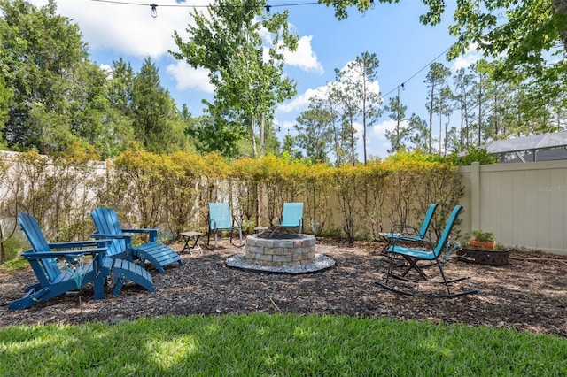 3243 Stonegate Falls Dr, Land O Lakes, FL 34638 - fenced backyard with a fire pit