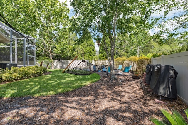3243 Stonegate Falls Dr, Land O Lakes, FL 34638 - view of yard with a lanai and view of wooded area