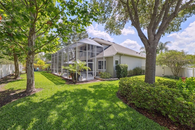 3243 Stonegate Falls Dr, Land O Lakes, FL 34638 - rear view of property featuring stucco siding and a lanai
