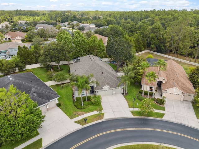 3243 Stonegate Falls Dr, Land O Lakes, FL 34638 - aerial perspective of suburban area featuring a forest
