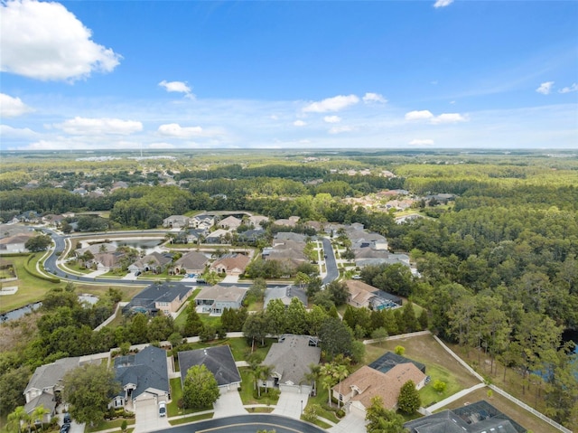 3243 Stonegate Falls Dr, Land O Lakes, FL 34638 - aerial view of property and surrounding area featuring nearby suburban area and a heavily wooded area