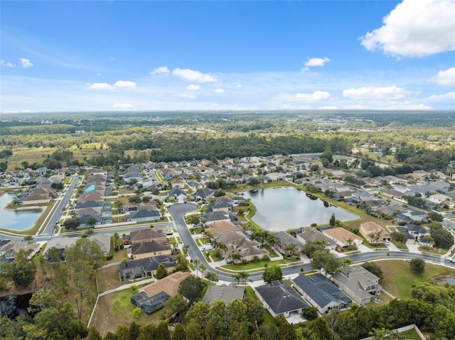 3243 Stonegate Falls Dr, Land O Lakes, FL 34638 - aerial view of property's location with nearby suburban area and a large body of water