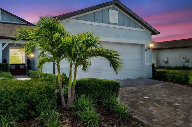 8431 Ocean Tides Cv, Parrish, FL 34219 - view of front of property featuring driveway, board and batten siding, and an attached garage