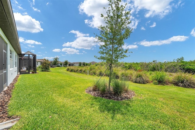 8431 Ocean Tides Cv, Parrish, FL 34219 - view of green lawn with glass enclosure