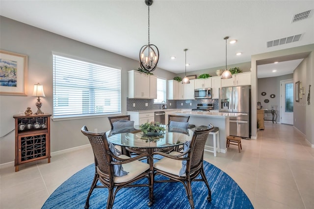 8431 Ocean Tides Cv, Parrish, FL 34219 - dining area with a chandelier, light tile patterned flooring, baseboards, and recessed lighting