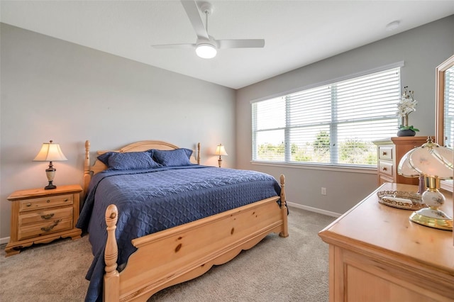 8431 Ocean Tides Cv, Parrish, FL 34219 - bedroom featuring light carpet, baseboards, and a ceiling fan