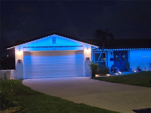 5340 Pilots Pl, New Port Richey, FL 34652 - ranch-style house with brick siding, concrete driveway, and a garage
