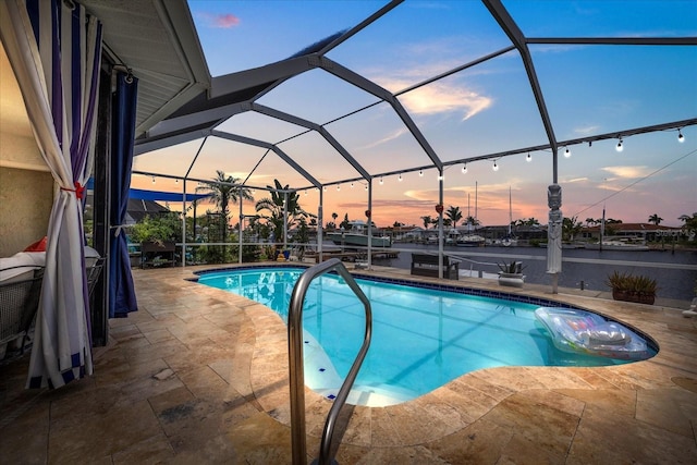 5340 Pilots Pl, New Port Richey, FL 34652 - swimming pool with a patio, glass enclosure, and a water view
