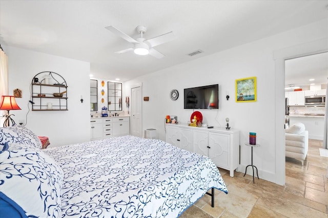 5340 Pilots Pl, New Port Richey, FL 34652 - bedroom featuring light stone finish floors and ceiling fan