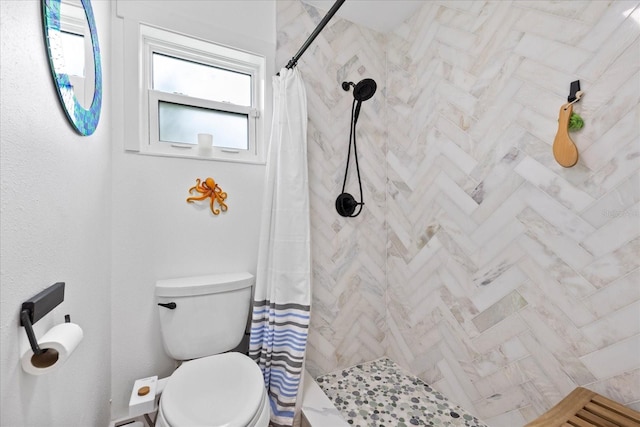 5340 Pilots Pl, New Port Richey, FL 34652 - bathroom featuring tiled shower and toilet