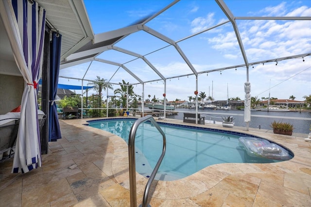 5340 Pilots Pl, New Port Richey, FL 34652 - outdoor pool featuring a patio, glass enclosure, and a water view