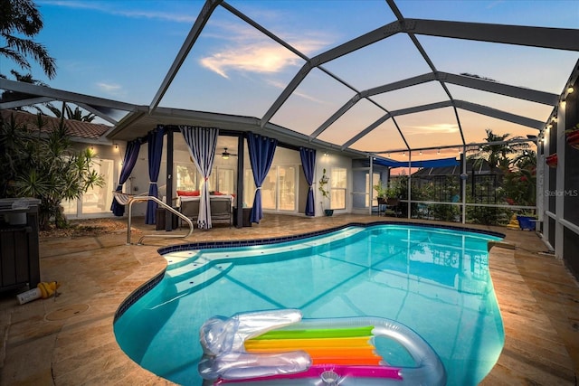 5340 Pilots Pl, New Port Richey, FL 34652 - pool at dusk featuring an outdoor pool, a patio, and a lanai