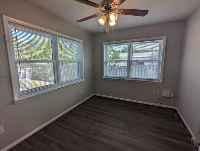 2004 Culberson Ave, Dunedin, FL 34698 - spare room featuring dark wood-style flooring, baseboards, and a ceiling fan