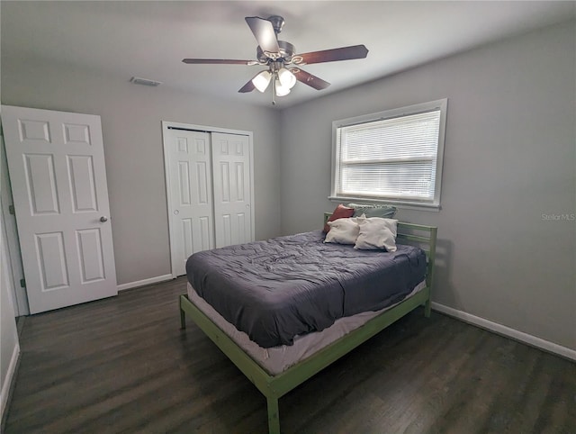 2004 Culberson Ave, Dunedin, FL 34698 - bedroom with baseboards, wood finished floors, a closet, and a ceiling fan