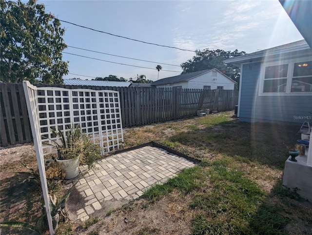 2004 Culberson Ave, Dunedin, FL 34698 - fenced backyard featuring a patio