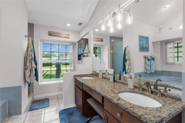 full bathroom with lofted ceiling, healthy amount of natural light, a shower stall, a garden tub, and recessed lighting